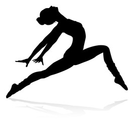 Ballet dancer woman in silhouette dancing in posed position