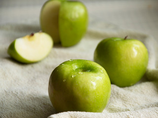 green apples lie on a white table