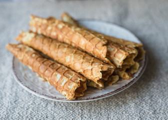 Homemade crispy waffles with ice cream and colorful sprinkles. 