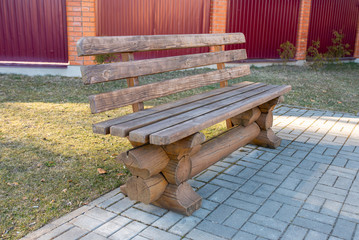 Wooden bench in the park for relaxation.
