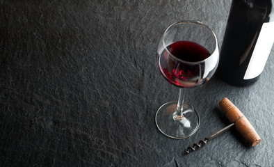 Wine bottle on dark background.