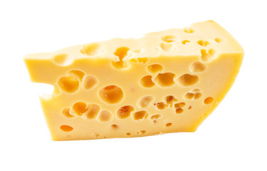 triangular chunk of yellow cow's milk swiss cheese with holes cutout on white background