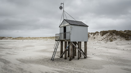 Netherlands, Terschelling - March 8, 2020: Famous authentic wooden beach hut, for shelter, on the...
