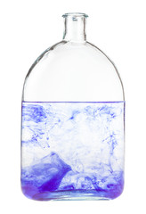 violet watercolour dissolves in water in bottle isolated on white background