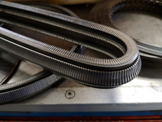 Fototapeta na wymiar Car Transmission gears chain made of real Steel. CVT transmission belt. Car engine part 