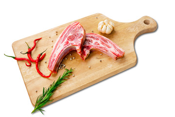 Closeup of fresh raw beef ribs on chopping board