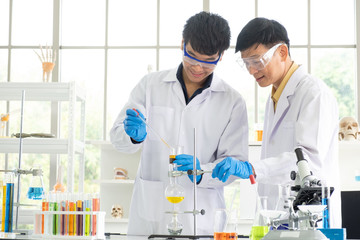 Science, Chemistry, Technology, Biology and Laboratory concept - Portrait of Asian senior and...