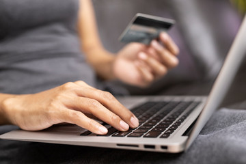 Women shopping online via credit cards. Business and Technology Concepts.