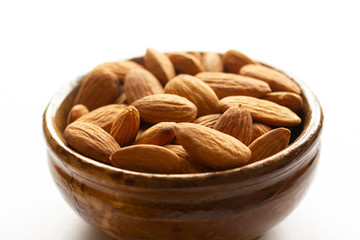 Fresh almonds on the plate. Background.