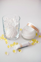 set of cosmetics for girls, home body and face care, anti-aging natural face cream, cotton buds, manicure oil, top view