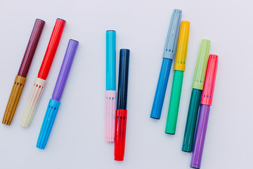 colored markers on a white background, lessons at home with children