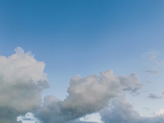 black and white clouds with blue sky