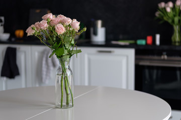 Bouquet of flowers in a vase on the kitchen table