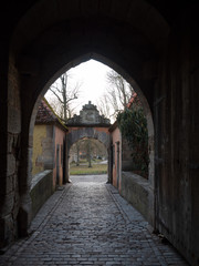 Fototapeta na wymiar Rothenburg ob der Tauber, Germany - Feb 16th, 2019: Entrance gate to the city wall of Rothenburg ob der Tauber, Germany