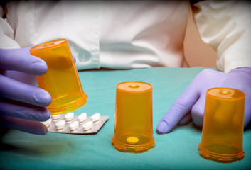 Doctor plays to Thimblerig with boats of medicine, conceptual image