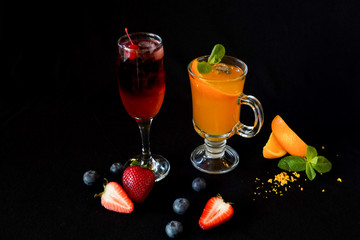 ren and orange alcohol beverages served in beautiful glasses