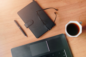 set for working from home, Notepad, headphones and laptop top view