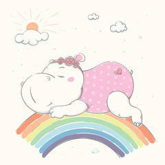 Lovely cute hippo is sleeping on a rainbow. Beautiful hippo dressed in pajamas and a bandage with flowers. - 343420838