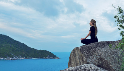 Serenity and yoga practicing by the sea with island view, meditation