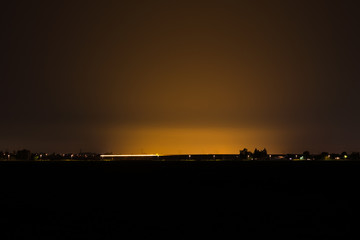 Night time image of light pollution by illuminated greenhouses in the western part of The Netherlands