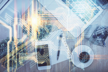 Double exposure of map hologram drawing over desktop. Top view. International connection concept.