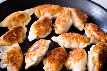 National Russian cuisine. Pierogi or pyrohy, vareniki, served with cottage cheese and potatoes on board.  Raw dumplings made of dough in handmade flour