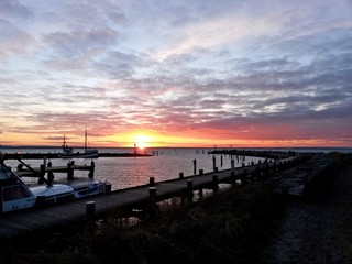 Obraz na płótnie Canvas sunset at the pier on Poal Island Germany