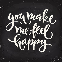 Vector You make me feel happy lettering in blackboard design.