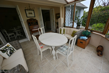 Table and chairs in a conservatory