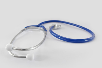 Fototapeta premium Blue stethoscope medical tool isolated on white background. Idea for doctor diagnostic coronavirus disease.