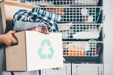 Recycle clothes concept. Recycling box full of clothes.