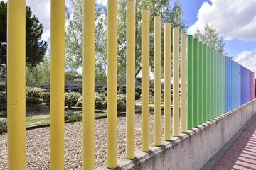 colorful fences crossing the road