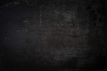 dark wall background. Empty workplace, in front of an abstract package.