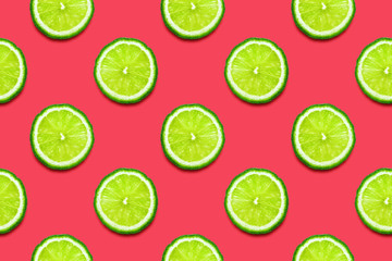 Lime slices seamless pattern on Crimson pink background. Minimal summer concept. Flat lay, trendy juicy color.