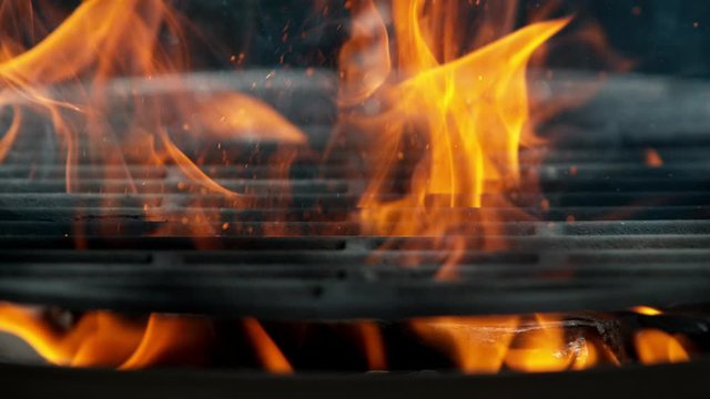 Cast iron grate with Fire flames and sparkles, shooting on high speed camera at 1000fps