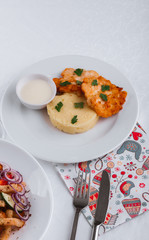 
dinner menu, feast and chicken cutlet with salad and red wine in combination with a tablecloth, tableware on the table