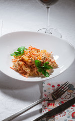 wine and salad, on the table in a white bowl beautiful dinner