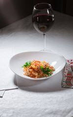 wine and salad, on the table in a white bowl beautiful dinner