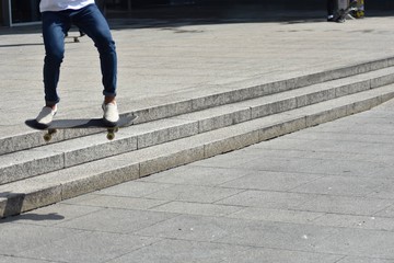 skateboarder jumping in the street
