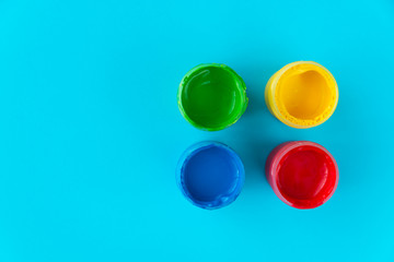 colorful paint buckets on a colored background