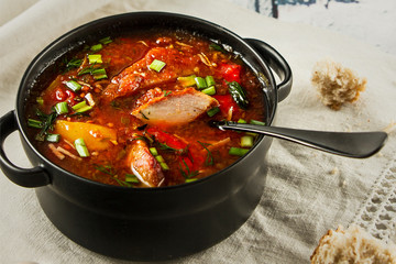 a pot of hot borscht on the table