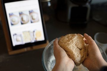 close up on a teenager hands preparign cookie dough