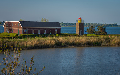 Fototapeta na wymiar Lighthouse of Willemstad, North Brabant, The Netherlands. Built in 1947, now serving as a mini museum