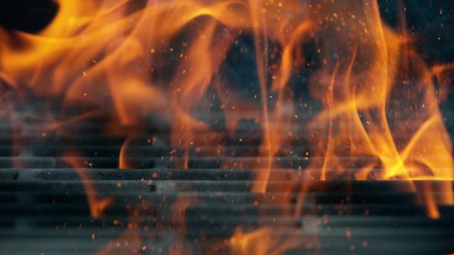 Cast iron grate with Fire flames and sparkles, shooting on high speed camera at 1000fps