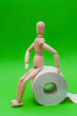 Toilet paper and wooden man on yellow background, space for text