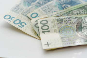 Obraz na płótnie Canvas polish zloty banknotes on the white background