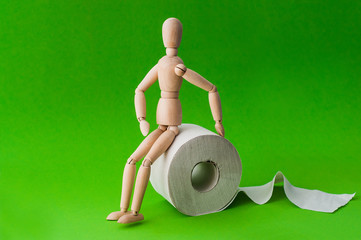Toilet paper and wooden man on yellow background, space for text