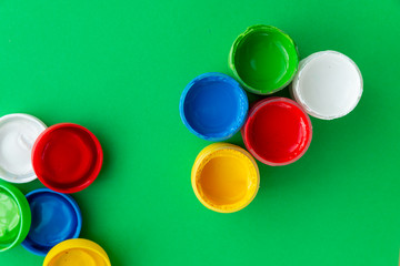 colorful paint buckets on a colored background