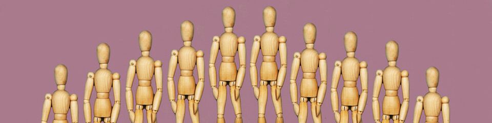 Wooden dummy with hands on hips on grey backgroundToilet paper and wooden man on yellow background, space for text