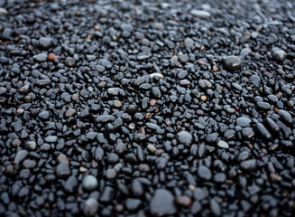 Gray pebbles as a background in the Iceland sea shore. Abstract composition. Design - image